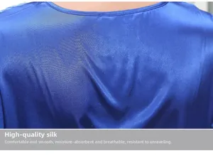 Detailed macro view of the premium blue silk fabric texture on the luxury pajama collar