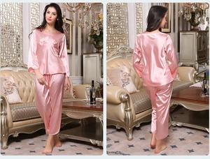 Front and back view of pink silk satin long-sleeved pajamas set with elegant V-neck detail