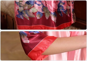 Detail of silk satin pajamas with peony floral print and contrasting pink piping