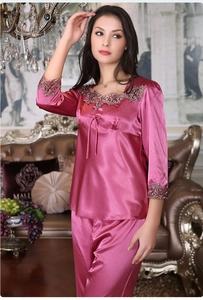 Lace embroidery detail on V-neck and cuffs of pink silk satin pajama set