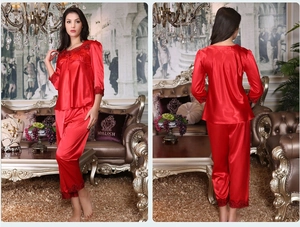 Elegant red satin long-sleeve pajamas set featuring intricate lace trim and silky texture