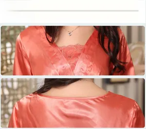 Detailed view of the V-neckline and intricate lace embroidery on silk satin sleepwear