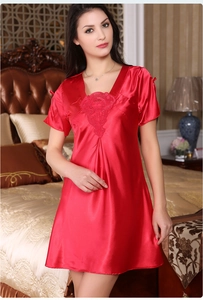 Close-up of red satin nightgown featuring elegant V-neckline with lace embroidery details