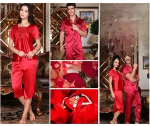 Detailed views of red silk couple pajamas featuring lace embroidery and smooth satin fabric