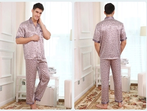 Detail of men's satin pajama set featuring paisley patterns with front and back views