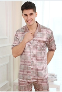Detail of men's pink silk satin pajamas with plaid patterns and a classic notch lapel