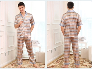 Detail of men's short-sleeve satin pajama set with chevron pattern and navy piping trim
