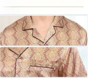 Detail of men's satin pajama shirt with geometric floral print, lapel collar, and chest pocket