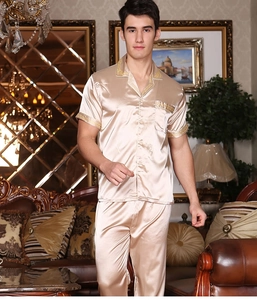 Detail of men's champagne satin pajamas set with elegant gold embroidered borders