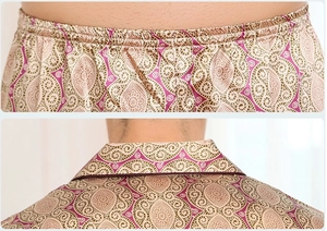 Detail of silk-like men's pajama set featuring elastic waistband and lapel collar texture