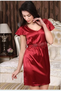 Detail of dark red silk satin nightgown featuring elegant lace embroidery and V-neckline