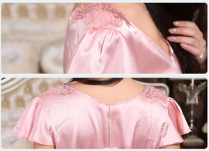 Detailed back view of pink satin nightgown featuring floral lace and V-neck design