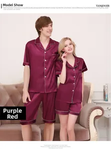 Close-up of burgundy silk pajamas for couples with elegant white piping and satin sheen