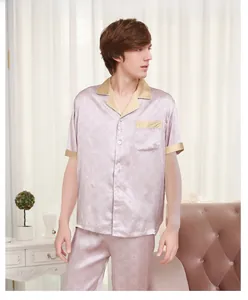 Close-up of luxury silk pajamas featuring geometric patterns and satin contrast trim