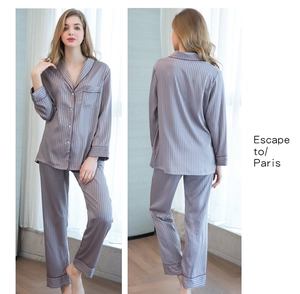 Detail of silk satin striped pajama set with contrast piping and button-down front