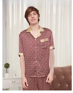 Close-up of men's silk pajamas set in burgundy featuring white geometric print details