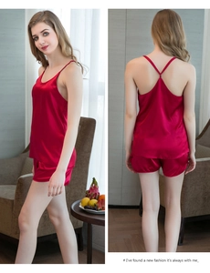 Detail of burgundy silk satin camisole and shorts set with thin straps on female model