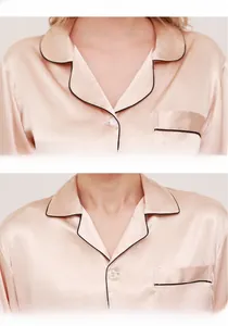 Detail of champagne silk pajamas showing the lapel collar and pocket with black piping