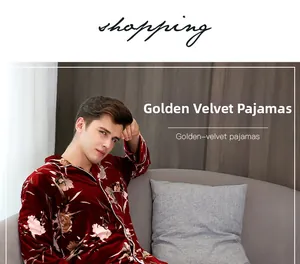 Close-up of deep red golden velvet pajamas with floral patterns and white piping