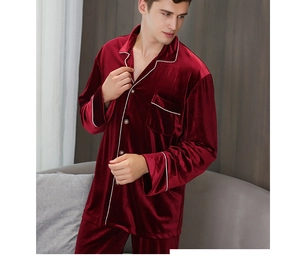 Close-up of luxury burgundy velvet men's pajama set with white piping and chest pocket