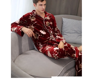 Detail of burgundy velvet pajamas with floral pattern and contrast white piping