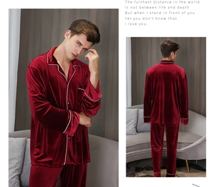 Detail of burgundy velvet men's pajamas with white contrast piping and luxury texture