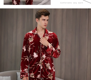 Detail view of burgundy velvet men's pajamas with floral patterns and white piping trim