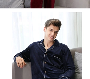 Detail of dark blue velvet pajama top with classic lapel collar and white piping