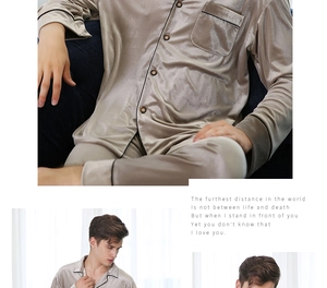 Detailed macro view of champagne gold satin pajamas with black piping and silk texture