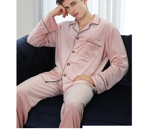 Detail of pink velvet men's pajamas set with black piping and classic lapel design