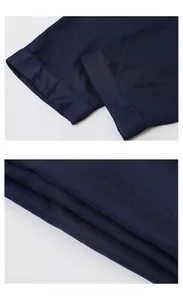 Detail view of navy silk pajama pants featuring double-stitched hem and fine texture