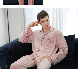 Detail of red velvet men's pajama set with black trim and classic button-up collar