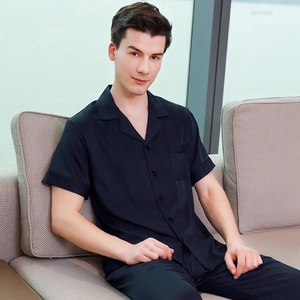 Men's navy blue silk satin pajama set with short-sleeve button-up shirt and long pants