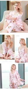 Three-piece light pink floral silk satin pajama set with camisole, pants, and robe