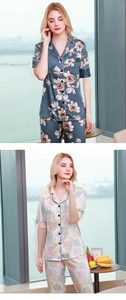 Close-up of short sleeve floral satin pajama set with contrast prints on smooth fabric