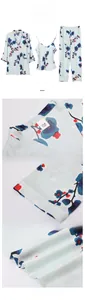 Detailed views of light blue silk pajamas with dark blue plum floral patterns