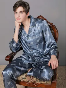 Detail of navy blue silk pajama set for men featuring exotic leopard and leaf patterns