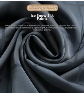Detail of dark grey silk pajamas fabric featuring a smooth texture and subtle grid pattern