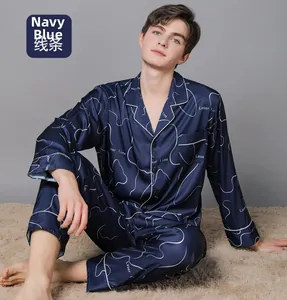 Detail of navy blue silk pajamas for men with white wave lines and classic lapel collar