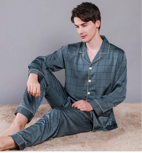 Detailed view of grey silk pajamas for men with checked pattern and gold piping