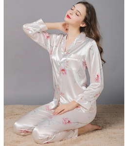 Detail of floral champagne satin pajama set with long sleeves and notch collar