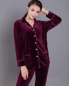 Detail of burgundy embossed velvet pajama set with white piping and quilted texture