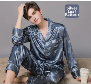 Close-up of men's navy satin pajama set with silver leaf and leopard print patterns