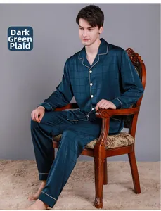 Detail of dark green checkered silk pajamas set with contrast piping on the collar