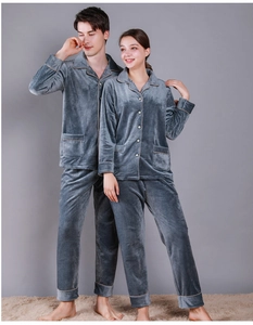 Detail of grey-blue velvet couple pajamas set with soft textured waffle fabric