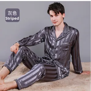 Detail of men's grey striped silk pajama set featuring long-sleeved shirt and trousers