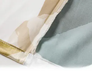 Macro view of precise inner quilting and stitching on printed silk pajama fabric