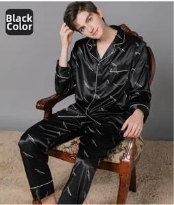 Detail of men's black silk-like pajama set with white fashion letters and notch lapel