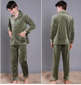 Close-up of olive green velvet men's pajamas set showing textured fabric and buttons