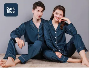 Detail of navy blue silk satin couple pajamas with contrast piping and lapel collar